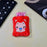 Pink cat hot water bag with cover for soothing menstrual cramps
