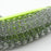 Close-up of kitchen washing brush showing wire bristles and bendable handle.