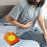 Small orange hot water bag for hand and feet warmth