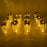 Assortment of gold LED candles with flickering effect, perfect for Christmas and other celebrations.