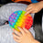 Round  it stress toy with colorful bubbles.