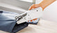 Mini sewing machine with fabric and thread