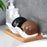 Unique snail-shaped soap dispenser for convenient liquid soap access.