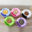 Functional serving bowl with a phone holder for snacks and fruits.