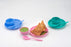 Snack set with a spoon, bowl, and dish on a table.