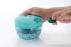 Vegetable chopper with stainless steel blades and brown package box.