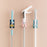 Self-adhesive mop and broom organizer for space-saving storage.