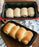 Durable steel baking tray with non-stick surface.